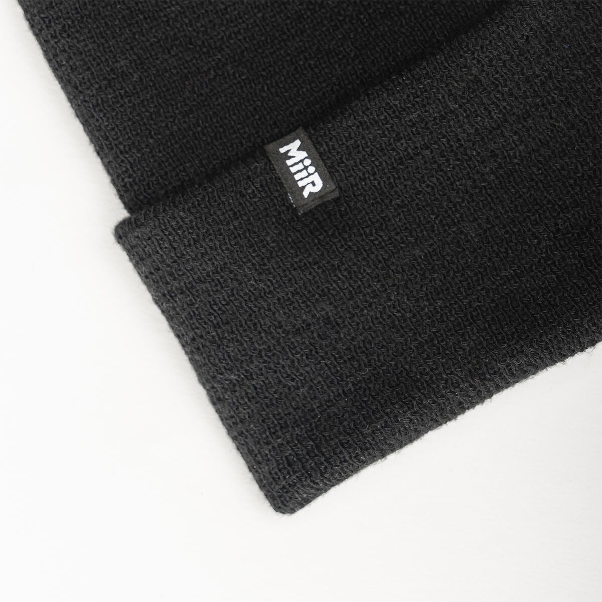 recycled-poly-fine-knit-beanie-p3 WebPDP-RecycledPolyFineKnitBeanie_Studio_TagDetail_Black__BNE005002OS.jpg