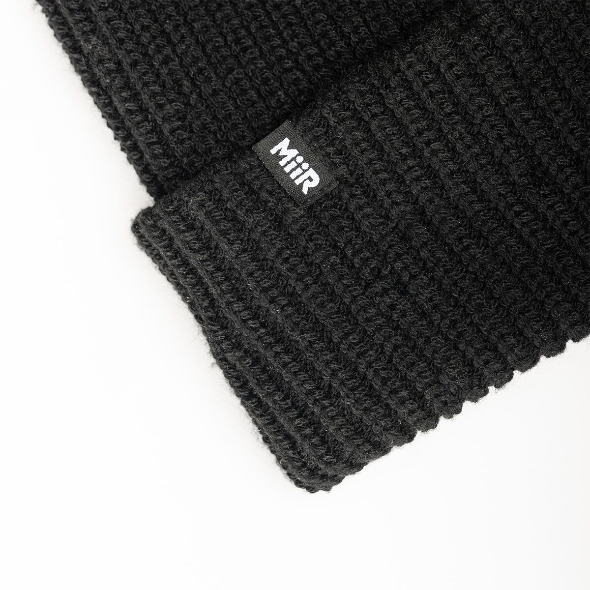 recycled-poly-rib-beanie-x7 WebPDP-RecycledPolyRibBeanie_Studio_TagDetail_Black__BNE002002OS.jpg